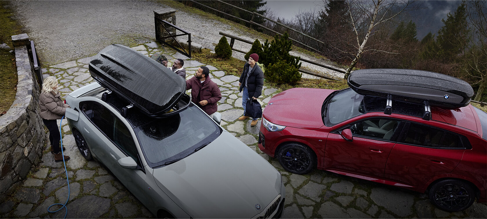 BMW's with BMW accessories, people standing around cars